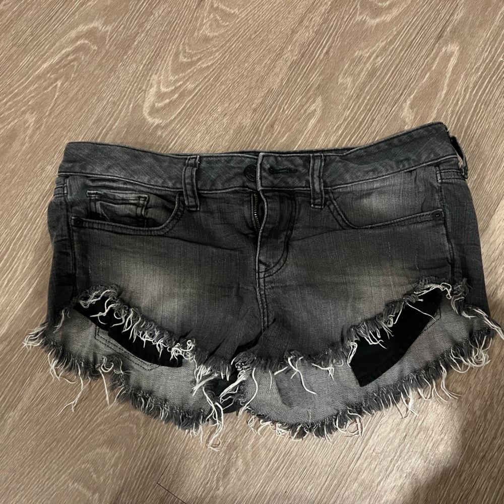 Express low rise jean shorts - size 4. Frayed at bottom